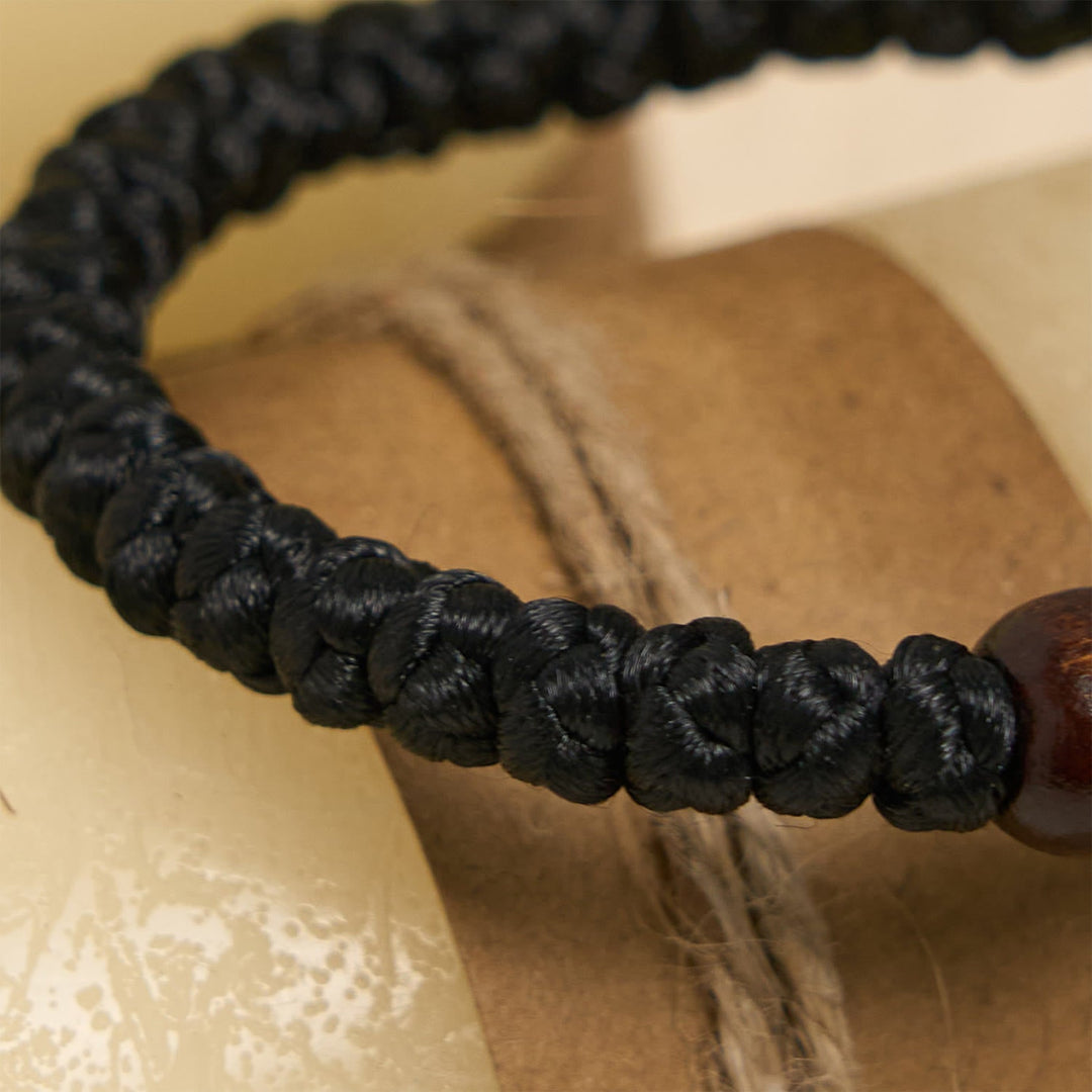 Blue & Black Cross - Knot String Bracelet: A Token of Faith