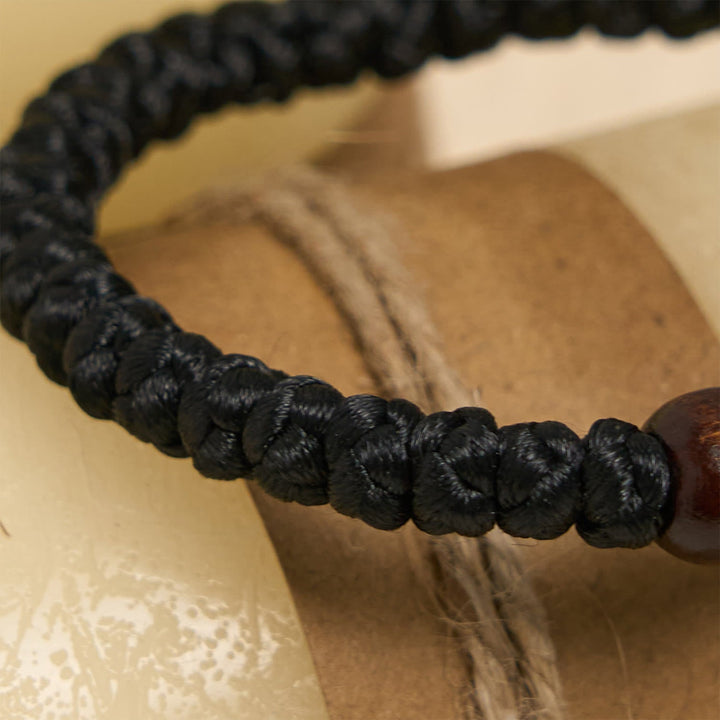 Blue & Black Cross - Knot String Bracelet: A Token of Faith