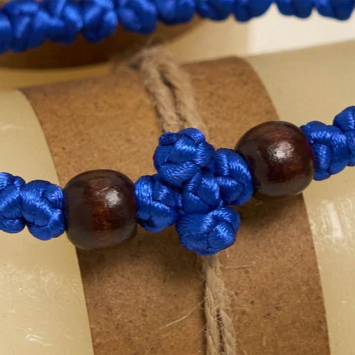 Blue & Black Cross - Knot String Bracelet: A Token of Faith