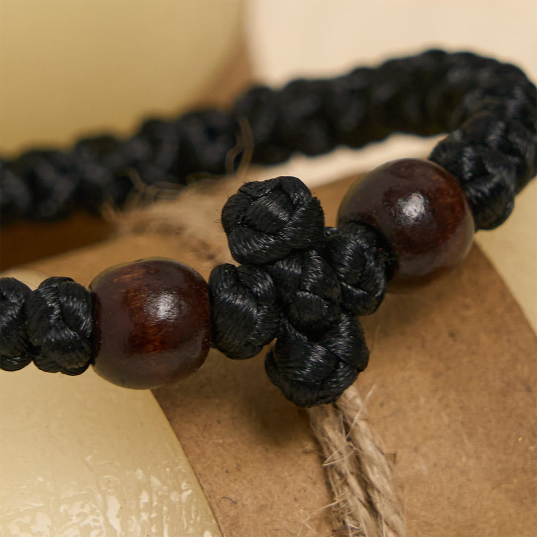 Blue & Black Cross - Knot String Bracelet: A Token of Faith