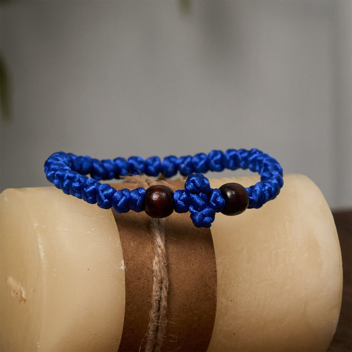 Blue & Black Cross - Knot String Bracelet: A Token of Faith