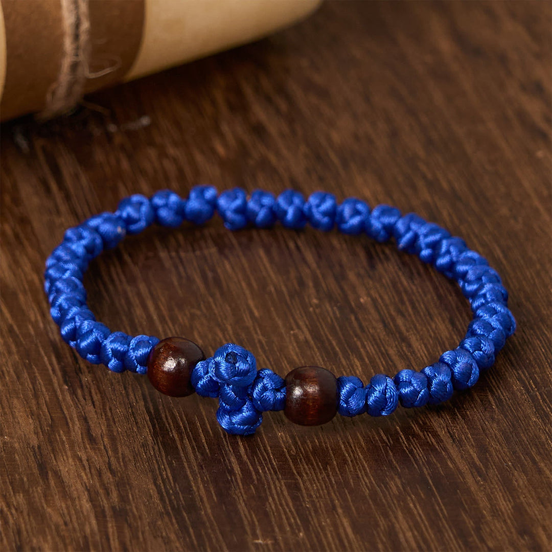 Blue & Black Cross - Knot String Bracelet: A Token of Faith