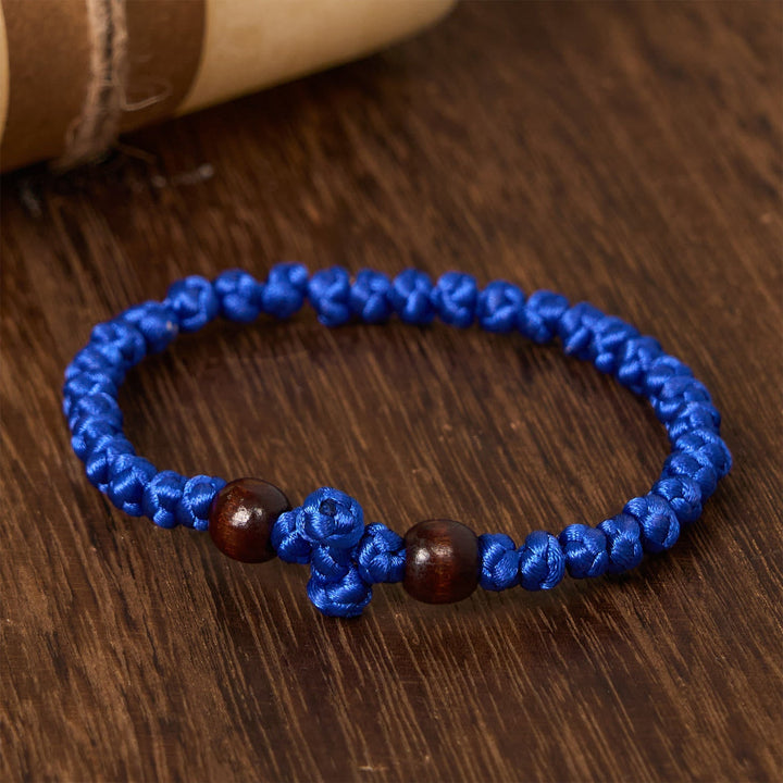 Blue & Black Cross - Knot String Bracelet: A Token of Faith