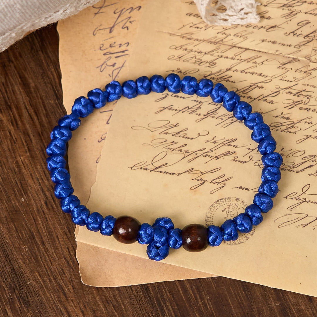 Blue & Black Cross - Knot String Bracelet: A Token of Faith