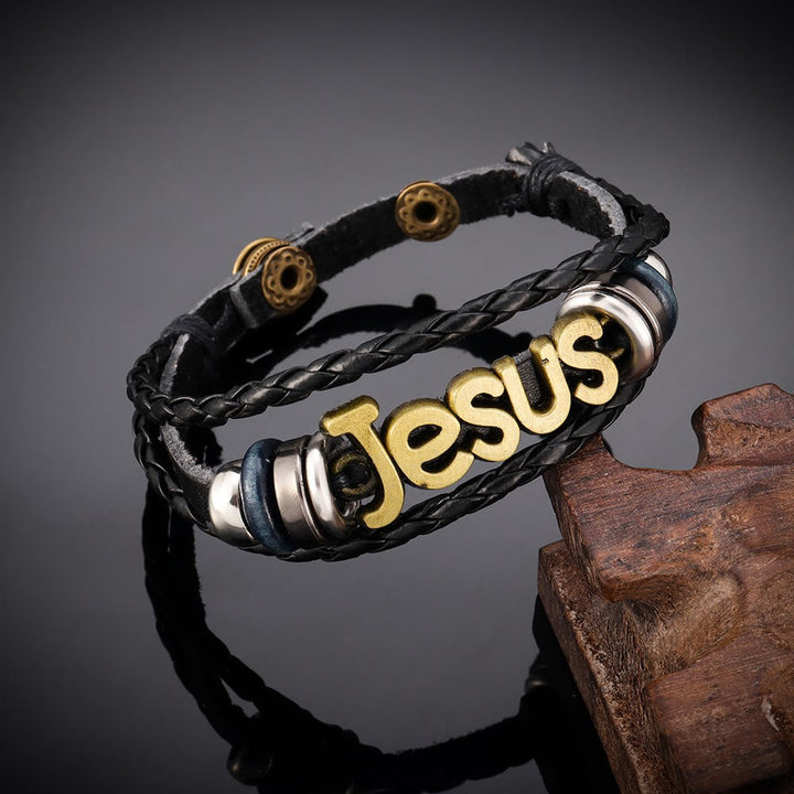 Two - Tone Jesus Charm Bracelet on Black Braided Leather