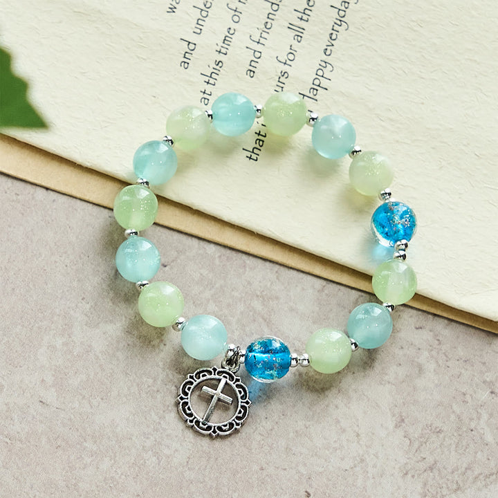 UV-Changing Glitter Bead Bracelet with Ornate Cross: Shimmer in Faithful Hues