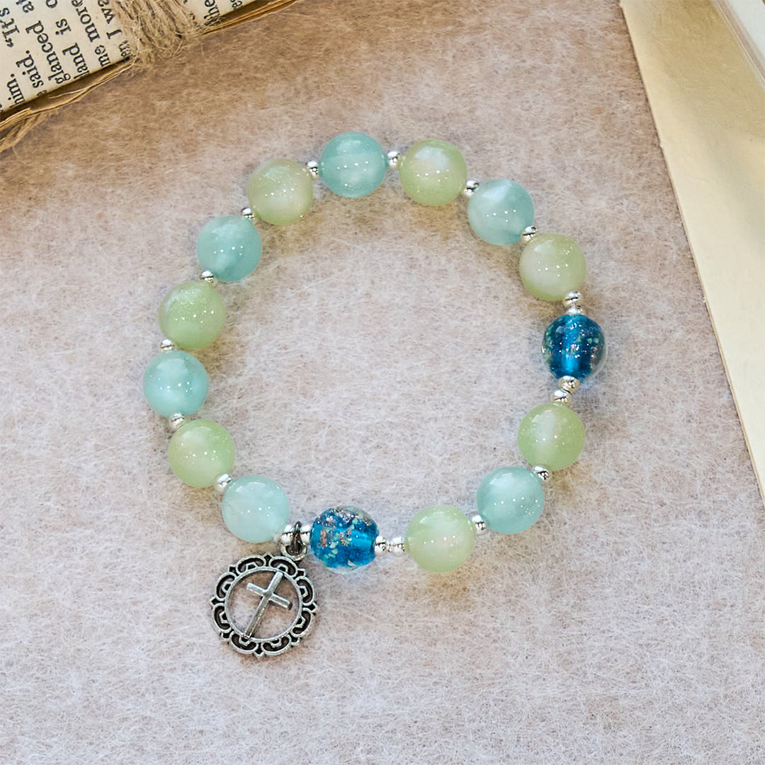 UV-Changing Glitter Bead Bracelet with Ornate Cross: Shimmer in Faithful Hues
