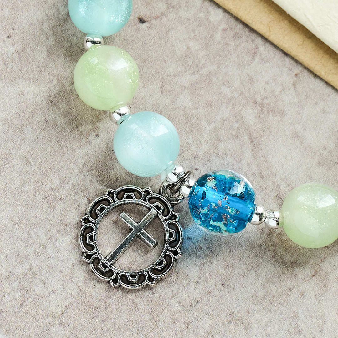 UV-Changing Glitter Bead Bracelet with Ornate Cross: Shimmer in Faithful Hues
