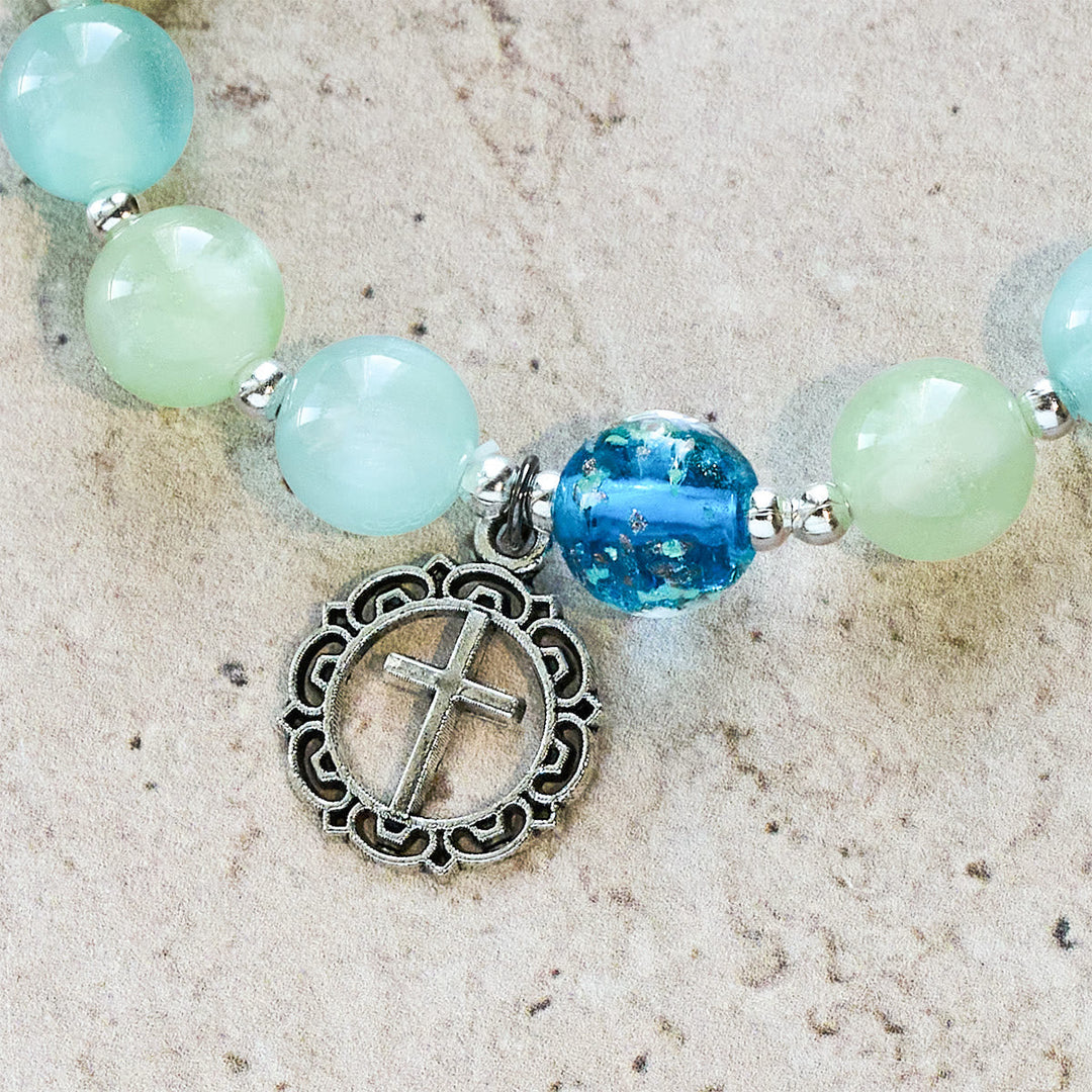 UV-Changing Glitter Bead Bracelet with Ornate Cross: Shimmer in Faithful Hues