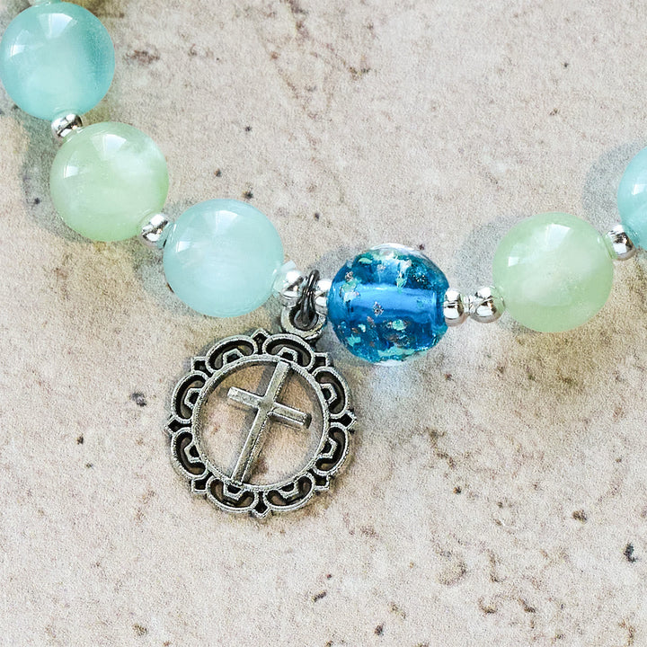 UV-Changing Glitter Bead Bracelet with Ornate Cross: Shimmer in Faithful Hues