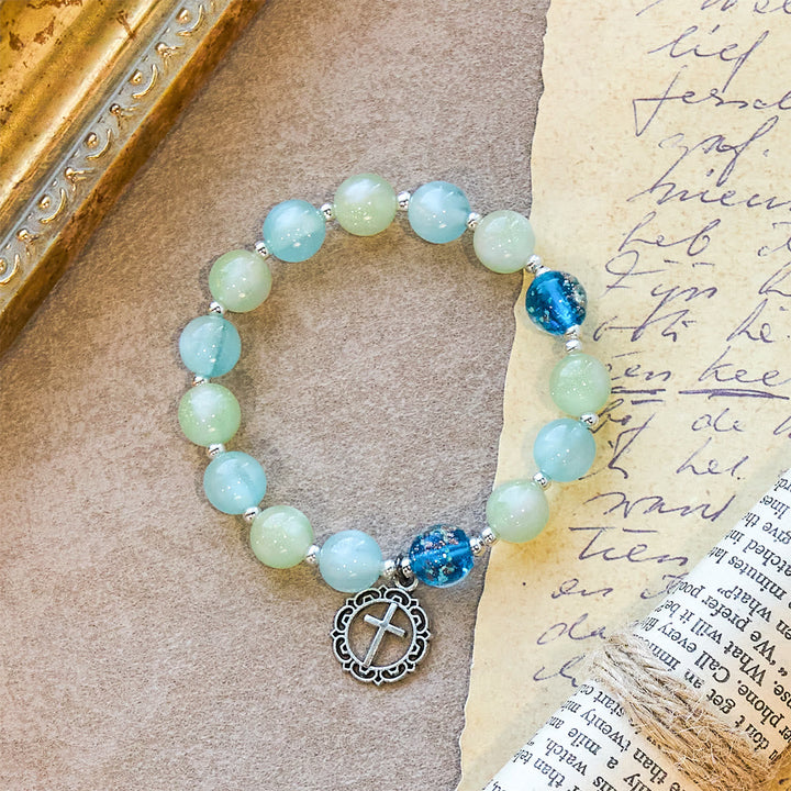 UV-Changing Glitter Bead Bracelet with Ornate Cross: Shimmer in Faithful Hues