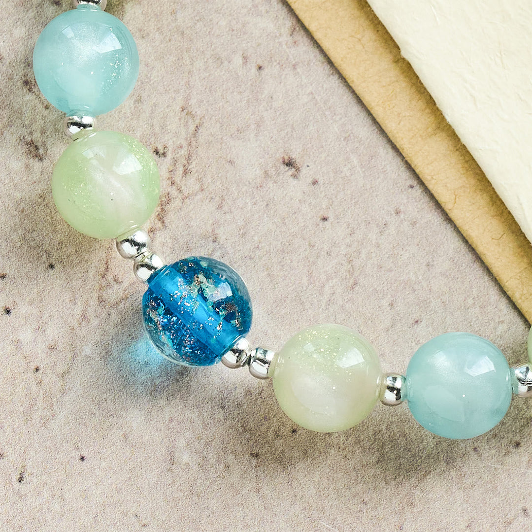 UV-Changing Glitter Bead Bracelet with Ornate Cross: Shimmer in Faithful Hues
