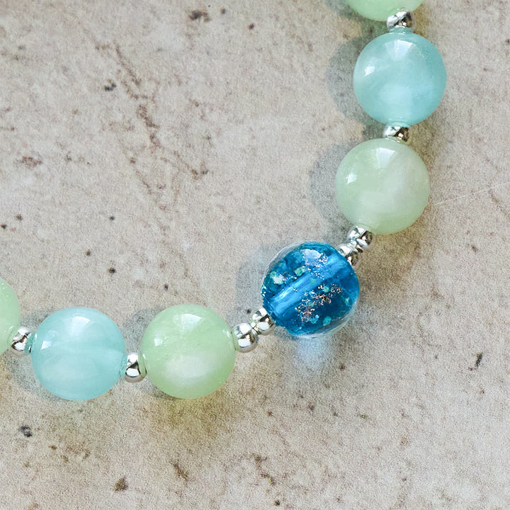 UV-Changing Glitter Bead Bracelet with Ornate Cross: Shimmer in Faithful Hues