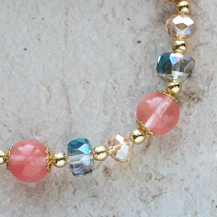 Pink Crystal & Multi-Faceted Bead Bracelet with Golden Crucifix: Dazzling Faith for Daily Style
