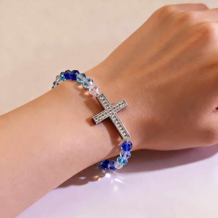 White & Peacock Blue Cross Bracelet: Belief Wrapped in Shimmer