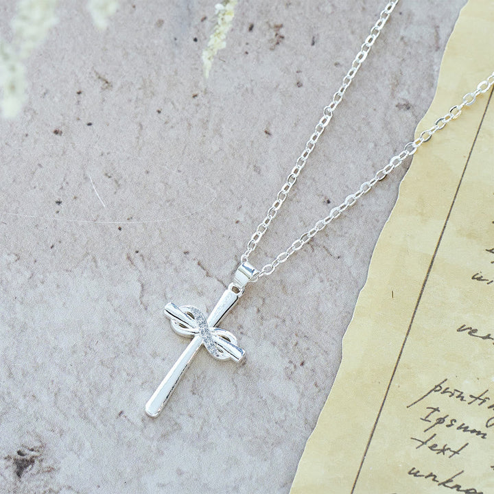 Möbius Cross & Zircon Necklaces: Smooth Comfort with Sacred Symbolism