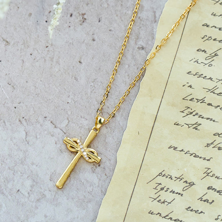 Möbius Cross & Zircon Necklaces: Smooth Comfort with Sacred Symbolism