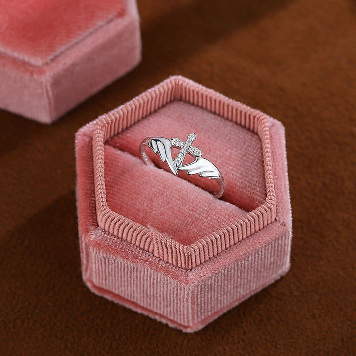 Silver Cross Wing Ring with Cubic Zirconia Accents: Embody His Angelic Protection