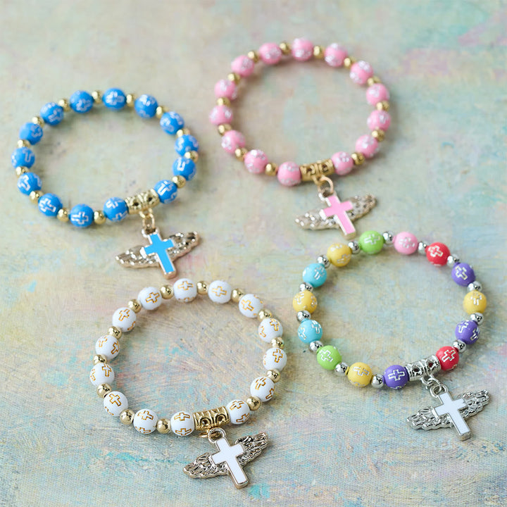 Winged Cross Charm Bracelet: A Visual Prayer of Devotion and Connection