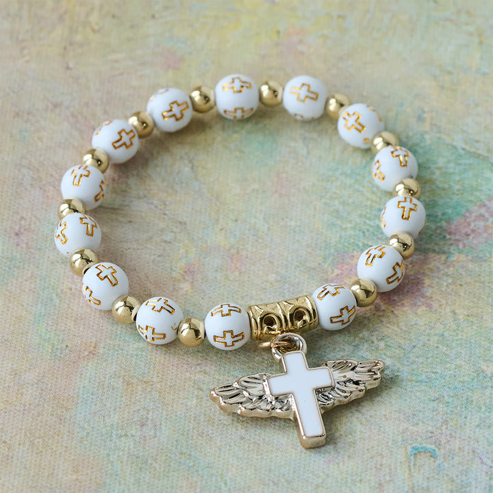 Winged Cross Charm Bracelet: A Visual Prayer of Devotion and Connection