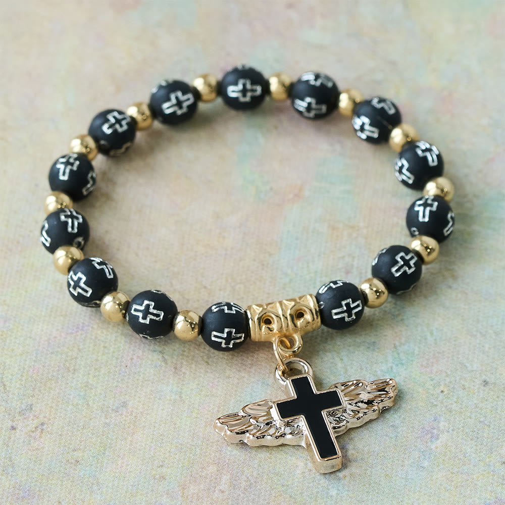 Winged Cross Charm Bracelet: A Visual Prayer of Devotion and Connection