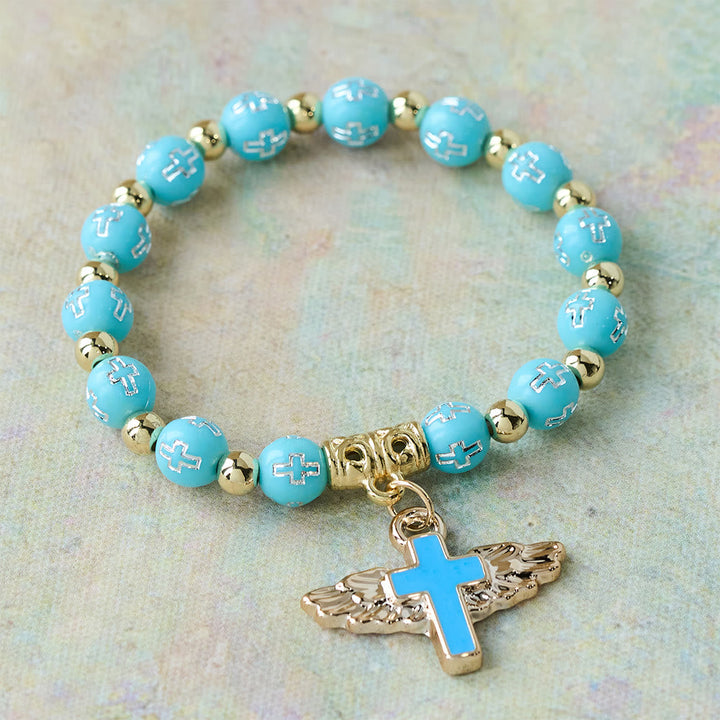 Winged Cross Charm Bracelet: A Visual Prayer of Devotion and Connection