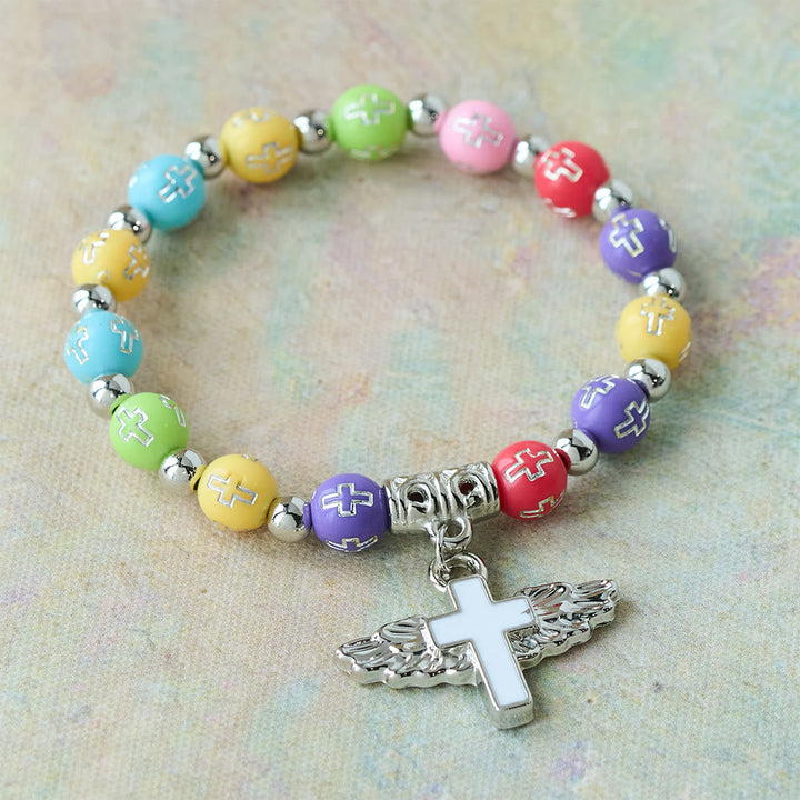 Winged Cross Charm Bracelet: A Visual Prayer of Devotion and Connection