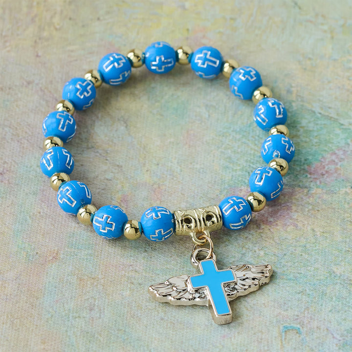 Winged Cross Charm Bracelet: A Visual Prayer of Devotion and Connection
