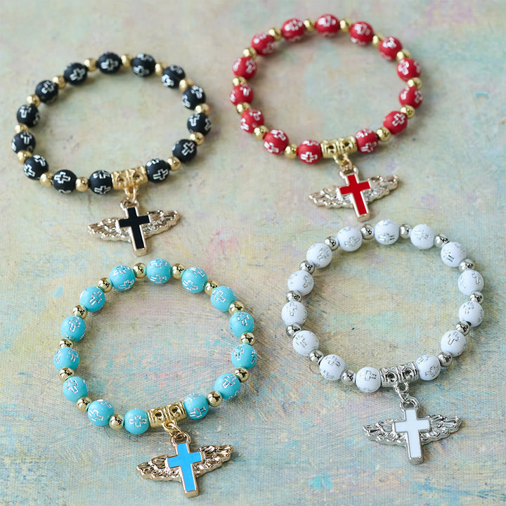 Winged Cross Charm Bracelet: A Visual Prayer of Devotion and Connection
