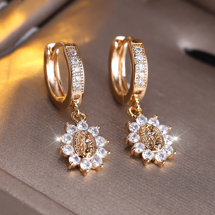 Our Lady Zircon Halo Huggie Earrings with Sunburst Medallion